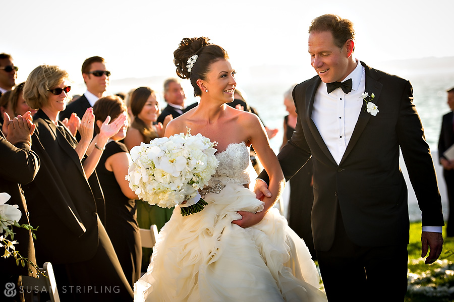 Kiara and Peter, the newlywed couple, gracefully walk down the aisle of their Belle Mer Wedding.