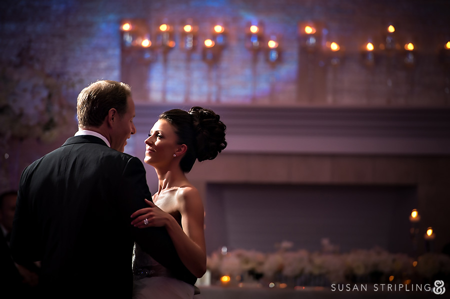 Peter and Kiara, the bride and groom, dance gracefully in front of candlelight at their Belle Mer Wedding. Peter and Kiara, the bride and groom, dance gracefully in front of candlelight at their Belle Mer Wedding.