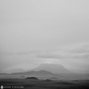 A black and white photo of a mountain in the desert, reminiscent of some Game of Thrones locations.