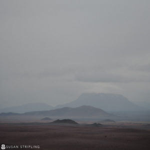 A cloudy sky with a mountain in the distance, perfect for Game of Thrones Location Photos.
