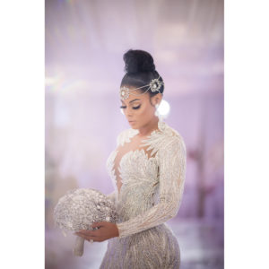 Gucci Mane and Keyshia Ka'oir Wedding Pictures featuring a bride in a white wedding dress holding a bouquet.