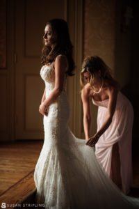 Two brides getting ready for their outdoor wedding at Oheka Castle.