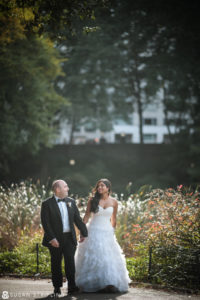 A bride and groom walking through Central Park after their wedding at Angel Orensanz.