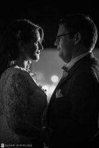 A bride and groom sharing an intimate moment during their New Year's Eve wedding.