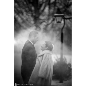A black and white photo of a bride and groom in the snow at a Cescaphe Philadelphia wedding.