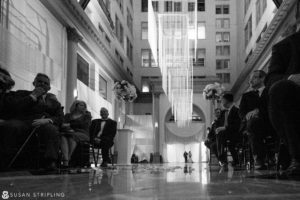A timeless black and white photo capturing a beautiful cescaphe wedding ceremony in Philadelphia.