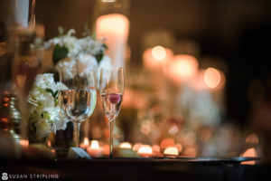 A cescaphe wedding table setting with wine glasses and candles in Philadelphia.