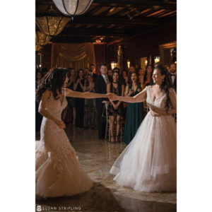Two brides dancing at a wedding reception at Shadowbrook in Shrewsbury.