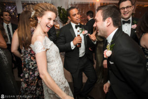 A destination wedding photographer captures the magical moments of a bride and groom dancing at their reception.