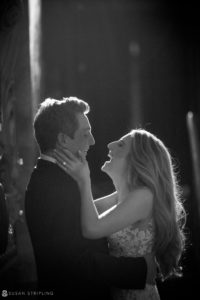 A black and white photo of a couple embracing on their rainy day wedding at Capitale.