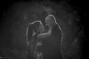 A black and white photo of an Indian couple embracing in Atlanta.