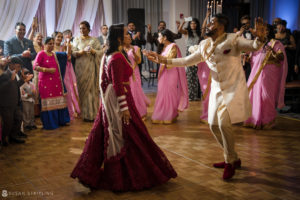 A bride and groom dancing at an Indian wedding reception held at Tarrytown House Estate.
