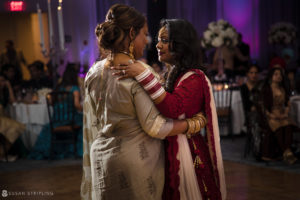 A mother and daughter beautifully perform a traditional Indian dance at a wedding reception held at the elegant Tarrytown House Estate.
