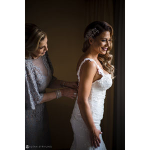 A bride assisting her mother at the Flowerfield Celebrations wedding.