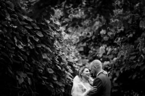 A black and white photo of a bride and groom at Flowerfield Celebrations.