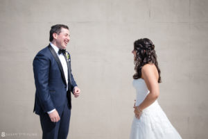 A bride and groom laughing at their wedding at Pier Sixty.