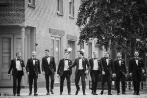 Black and white photo of groomsmen in tuxedos at a wedding at Pier Sixty.