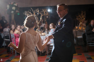 In the heart of Philadelphia, at the elegant Loews Hotel, a bride and her father share a heartfelt dance during a beautiful wedding reception.
