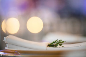 A napkin with a rosemary sprig on it, perfect for a wedding at the Berkeley Oceanfront Hotel.