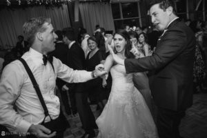 Bride and groom performing a delightful dance routine at a Pier Sixty wedding reception.