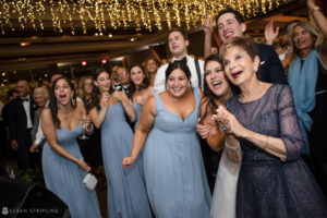 A group of brides and grooms at a wedding reception at Pier Sixty.