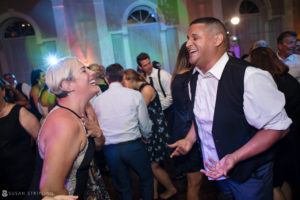 A man and woman dancing at a wedding reception held at the Berkeley Oceanfront Hotel.