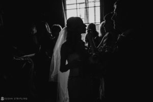 A summer wedding at the Gramercy Park Hotel, where a bride and groom gaze lovingly at each other in a dimly lit room.