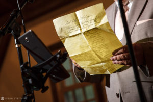 At a Riverside Farm, a man is holding a piece of paper.