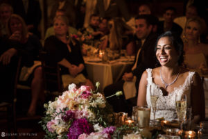 A Riverside Farm bride smiles at her summer wedding reception.