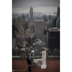 A bride and groom eloping on a rooftop overlooking Central Park.