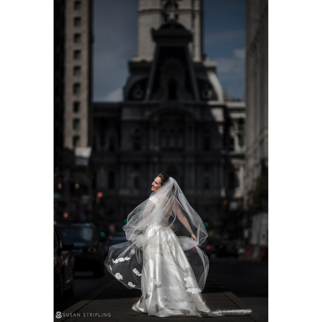 bridal portrait on broad street in front of city hall in philadelphia