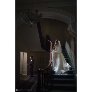 Wedding at the Westin in Philadelphia, featuring a bride and groom standing on a grand staircase.