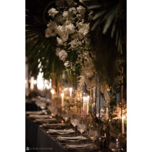 A wedding table set up with candles and flowers at the Hotel Brooklyn Bridge.