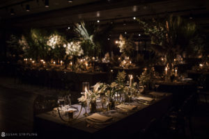 A wedding reception set up at Hotel Brooklyn Bridge with candles and greenery.