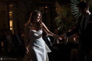 A wedding couple dancing at the 1 Hotel Brooklyn Bridge wedding reception.