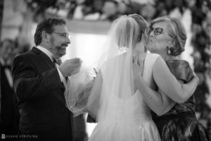 A bride kisses her mother during the wedding ceremony at the Westin in Philadelphia.