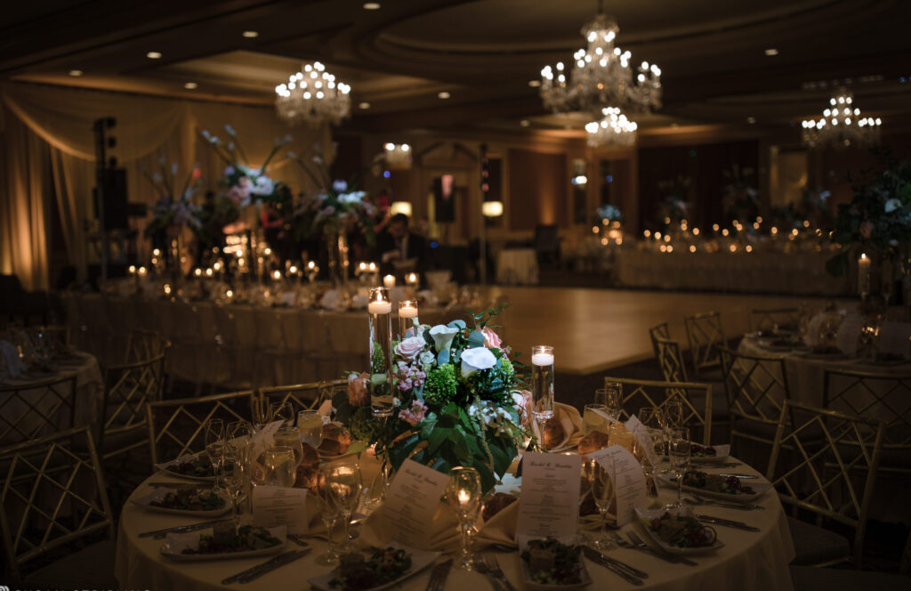 A wedding reception at the Westin in Philadelphia, elegantly adorned with candles and flowers.