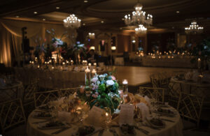 A wedding reception at the Westin in Philadelphia, elegantly adorned with candles and flowers.