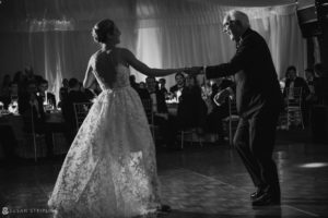 A bride and groom dancing at a Sleepy Hollow Country Club wedding reception.