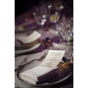 A Park Chateau wedding table setting with a place card on it.