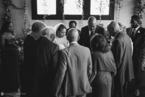A black and white photo of a wedding ceremony at 501 Union venue.