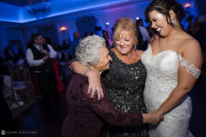 A bride and her mother dance at the Park Chateau wedding venue.