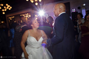 A bride and groom dancing at a wedding reception held at 501 Union.