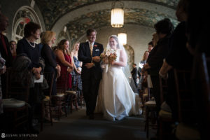 A wedding couple walking down the aisle in a beautiful Manhattan church.