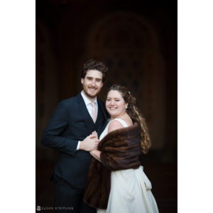 A Manhattan bride and groom posing for a private club wedding photo.