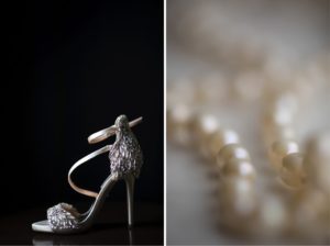 A pair of high heeled shoes with pearls and a necklace perfect for a wedding at the Alfond Inn.