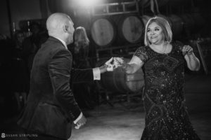 A man and woman dancing at a wedding held at Quantum Leap Winery.