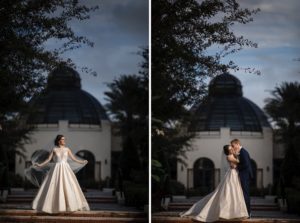 A wedding couple posing in front of the Alfond Inn building.