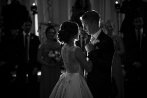 A wedding at the Alfond Inn, with the bride and groom sharing their first dance in black and white.