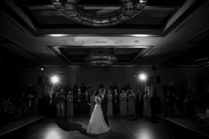A black and white photo capturing the beautiful wedding first dance of a bride and groom at the Alfond Inn.